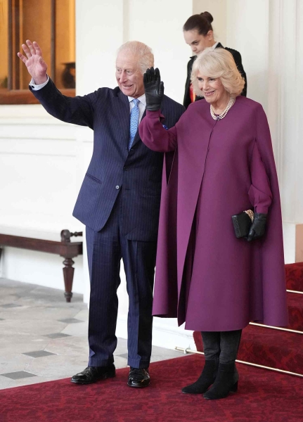 Queen Camilla attended a Christmas lunch in a festive suit and sentimental jewelry. See her holiday-ready look, here.