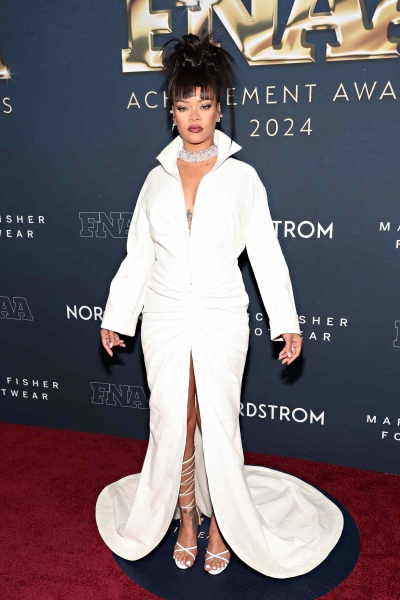 The Fenty founder joined her partner, A$AP Rocky, at the Footwear News Achievement Awards in New York City on Wednesday, December 4. See photos of her custom outfit, here.