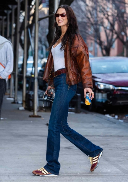 A shopping writer shares the celebrity-worn sneakers trending for spring 2025, including elevated white sneakers and sporty trainers worn by Katie Holmes, Jennifer Lawrence, and more. Shop sneakers from Adidas, Puma, Cariuma, and more starting at $70.