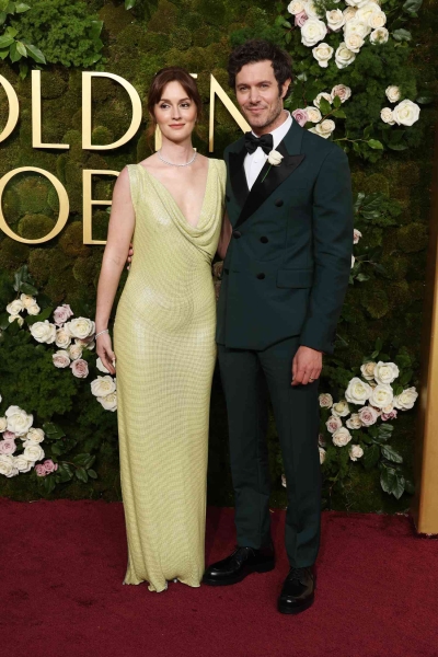 Adam Brody and Leighton Meester had a sweet couples' moment coordinating in green outfits at the 2025 Golden Globe Awards. See their outfits, here.