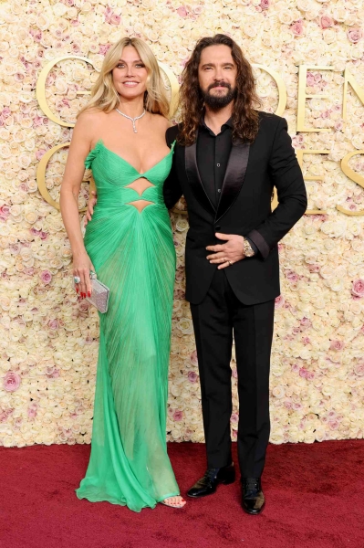 Heidi Klum arrived at the 2025 Golden Globes in an emerald green gown with two underboob cutouts. See her look here.