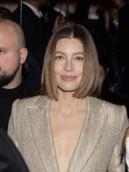 Jessica Biel wore a plunging tweed blazer and velvet pants to the show for Giorgio Armani Privé on January 28 as part of Haute Couture Fashion Week in Paris.