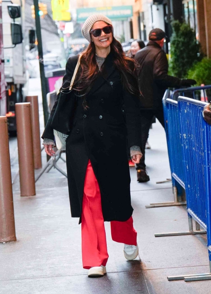 Katie Holmes wore bright red neon pants while attending her Broadway production 'Our Town' on January 18. See her outfit here.