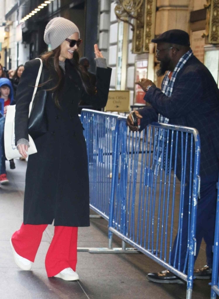 Katie Holmes wore bright red neon pants while attending her Broadway production 'Our Town' on January 18. See her outfit here.