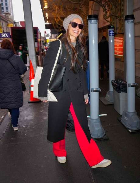 Katie Holmes wore bright red neon pants while attending her Broadway production 'Our Town' on January 18. See her outfit here.