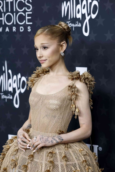 Ariana Grande looked like a whimsical ballerina as she wore a fishnet tutu-inspired dress by Dior Couture to the Critics' Choice Awards red carpet on February 7. See her Oz-coded look, here.