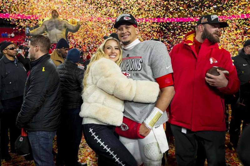 Brittany Mahomes arrived at Super Bowl LIX four weeks postpartum while wearing an all-white outfit that consisted of a cropped denim jacket, a corset, and flare-legged jeans. See her full look, here.