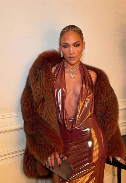 Jennifer Lopez had a revenge dress moment as she wore a barely-there brown halter gown with a plunging neckline and back to Clive Davis's pre-Grammys party on February 1. See her revenge dress and luxurious diamond accessories, here.