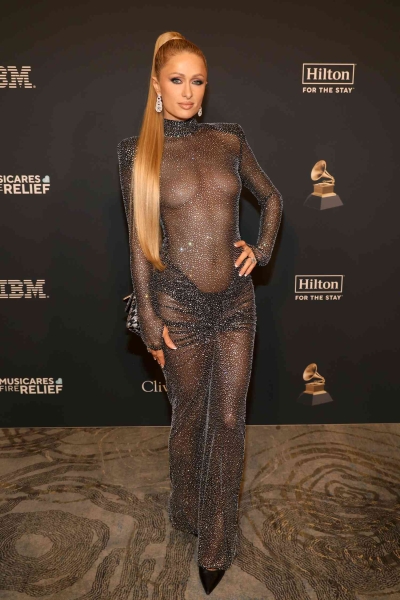 Paris Hilton wore her most naked dress yet as she went braless in a sheer LBD at Clive Davis's pre-Grammys party on Saturday, February 1. See her barely-there look, here.